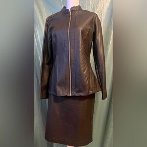 Valerie Steven’s black “leather look” suit